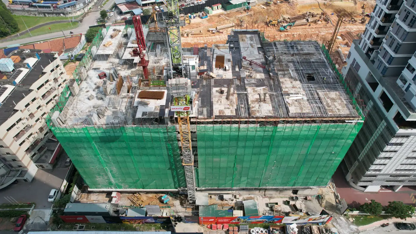 Aerial drone photo of the Gen Rise construction site in Johor Bahru, structural works in progress with tower crane